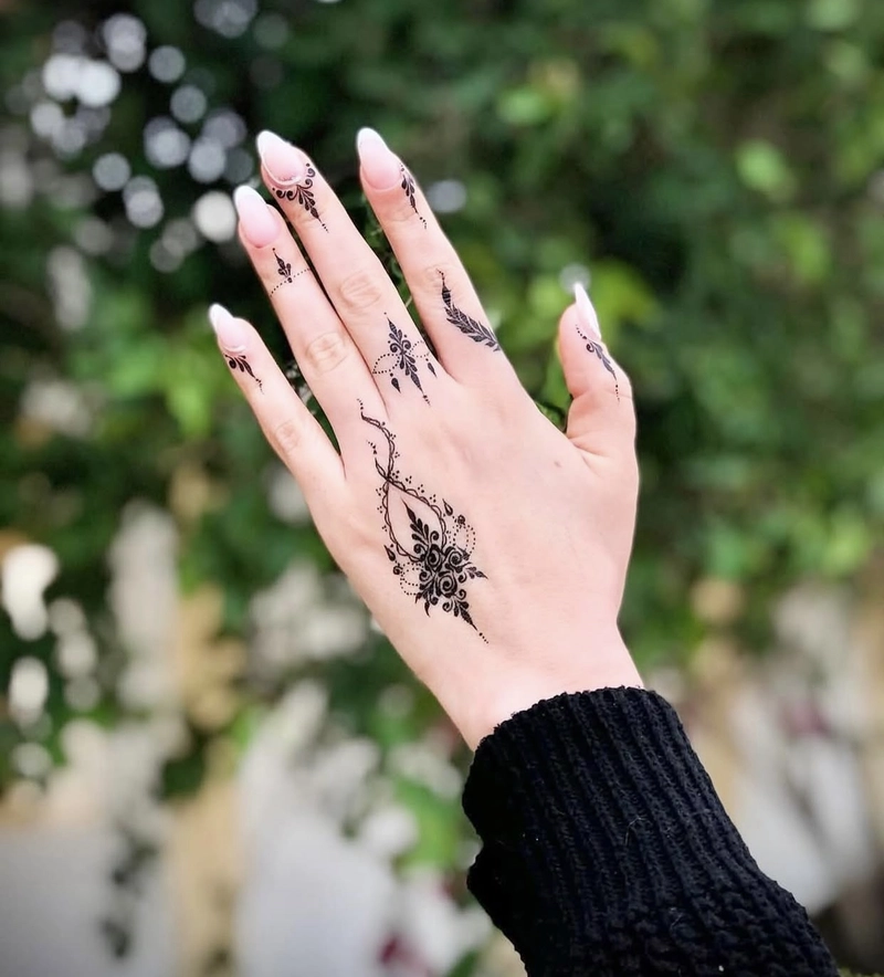 aesthetic mehndi design back hand tattoo