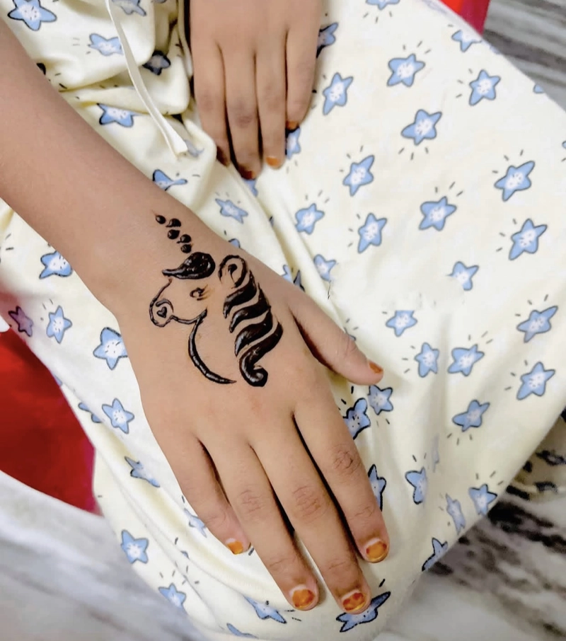 unicorn mehndi design back hand
